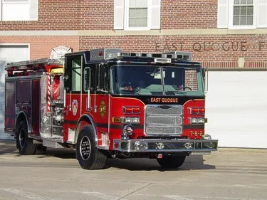 Front right exterior view showing grille, windshield, roof lightbar, and officer-side compartments.