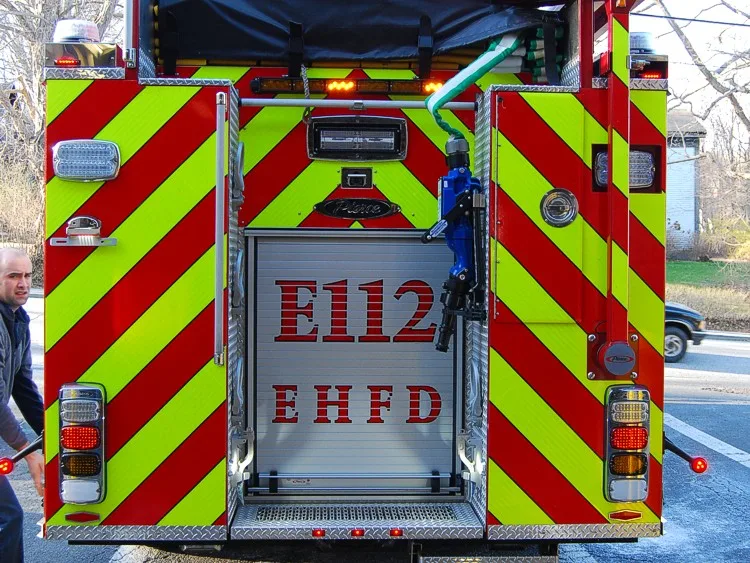 Rear view showing chevron striping and rear roll-up panel