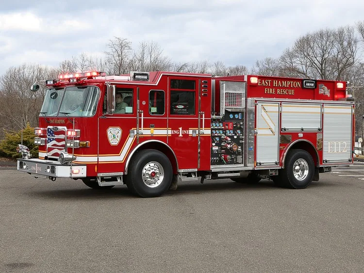 Driver-side profile with exposed pump panel showing gauges and controls