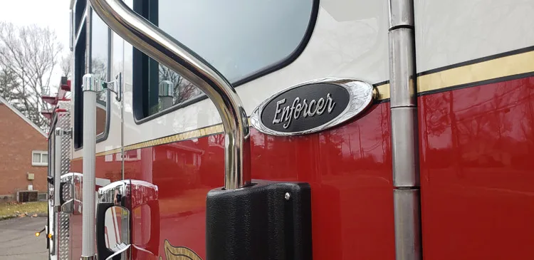 Cab-side detail close-up showing Enforcer badge and trim