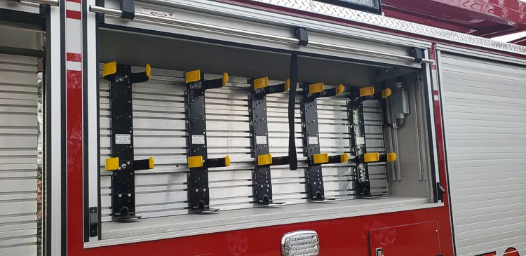 Open side compartment showing mounted hose and fittings in rack