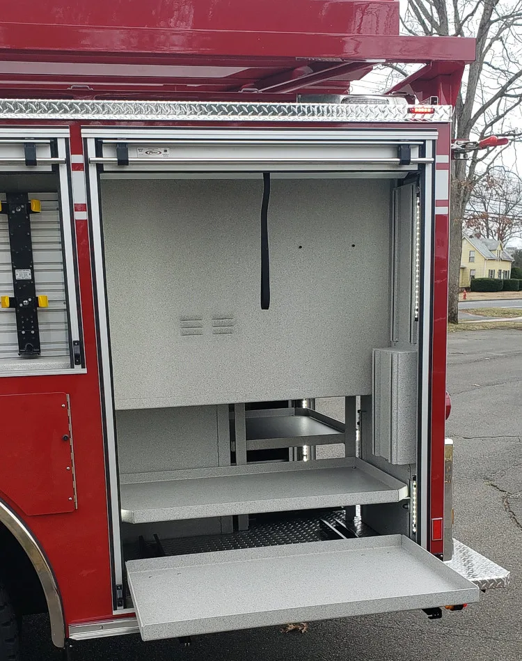 Open side compartment showing empty shelf bay with roll-up door raised