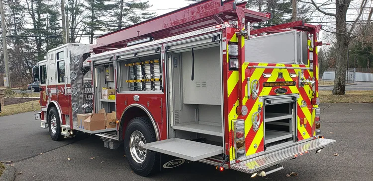 Rear-right exterior view showing side compartments and rear chevron panel