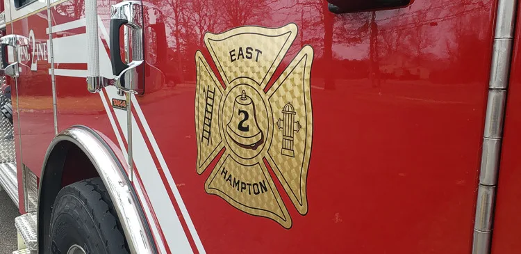 Cab door close-up showing department crest on red paint