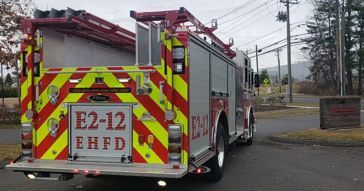 Rear view showing chevrons and upper hosebed opening
