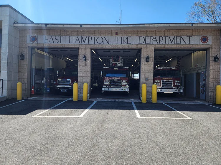 Station bay front view showing open doors and multiple apparatus inside