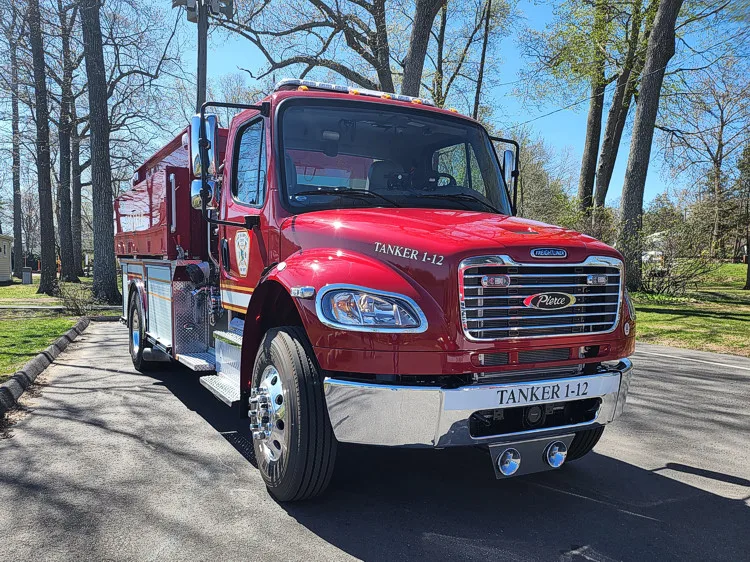 Front-right exterior view showing cab corner and tank body profile