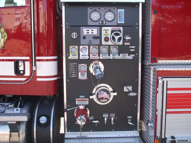 Pump panel close-up showing gauges, valves, and intake controls