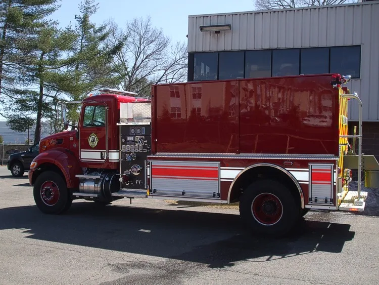 Driver-side profile showing tank body and rear wheel area