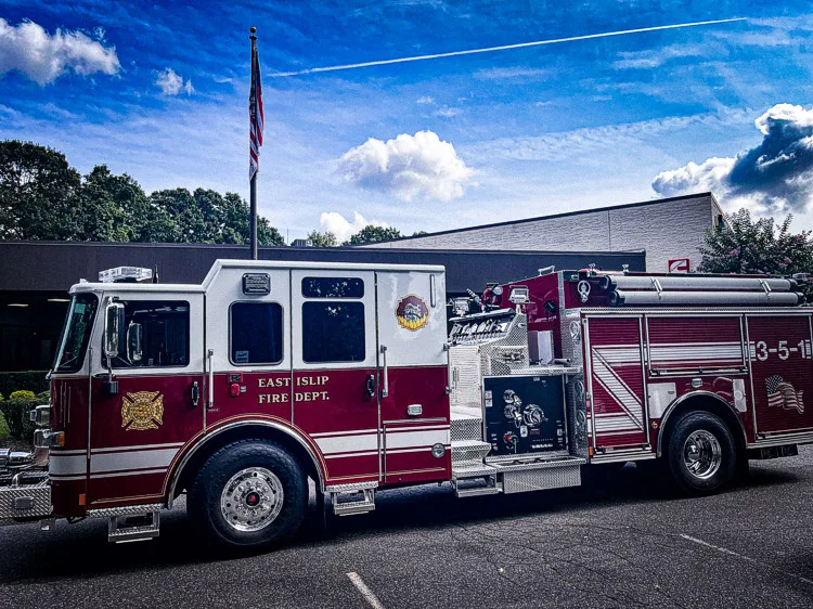 Driver-side profile with station and flag in background