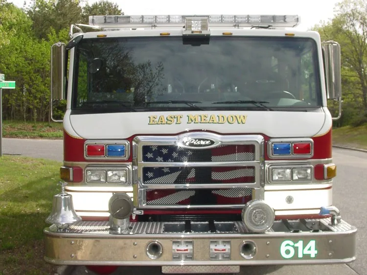 Front exterior view showing grille, bumper, and warning lights