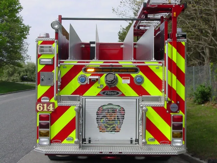 Rear view showing chevron striping and upper hosebed divider fins