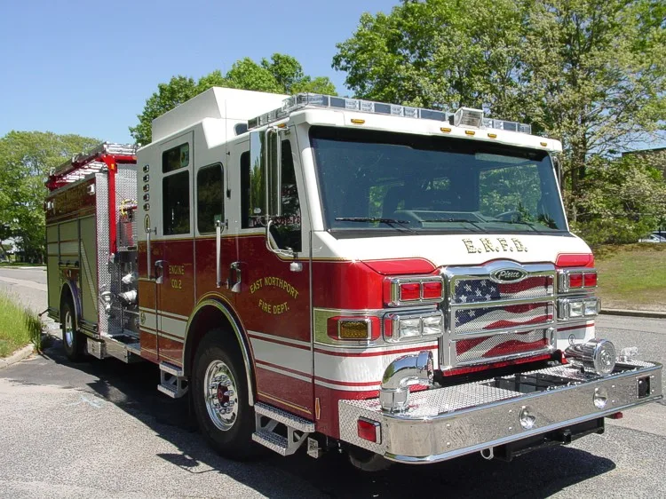 Front-right exterior view showing bumper, grille, and cab corner
