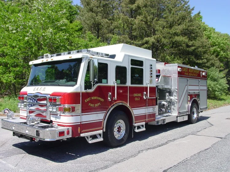 Front-left exterior view showing bumper, cab, and side body