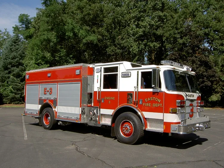 Passenger-side profile view showing body compartments and rear wheel area