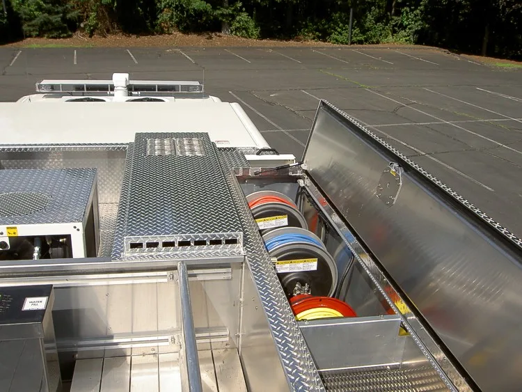 Top deck view showing hosebed walkways, crosslay covers, and deck surfaces