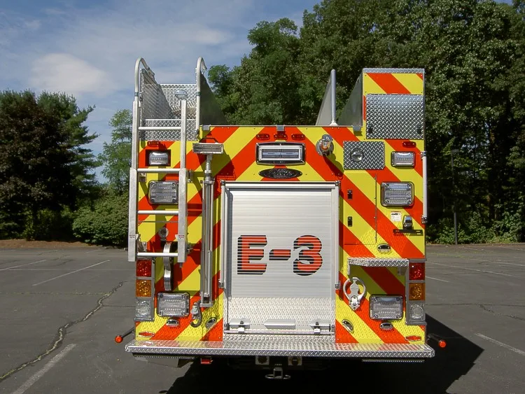 Rear view showing chevrons, rear warning lights, and lower step area