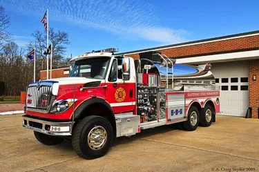 Front-left view of rescue pumper showing cab and side body