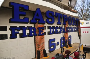 Close-up of raised blue lettering logo on side panel