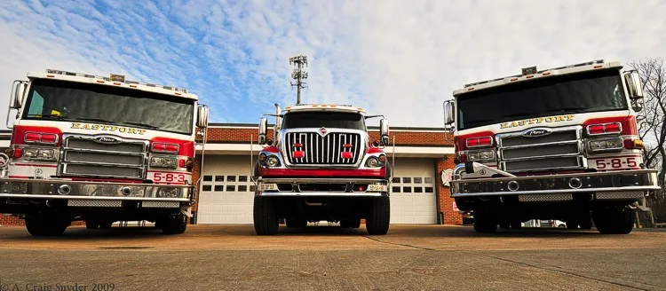 Low-angle lineup front view showing three grilles and bumpers