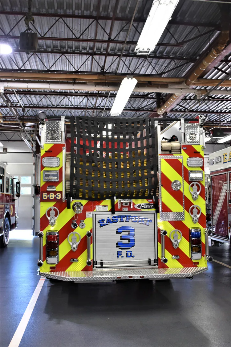 Rear view showing chevrons and open center rear compartment in bay