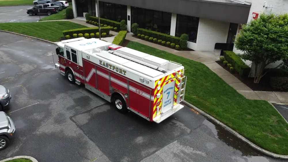 Aerial top-down rear-right view showing hosebed and rear chevrons