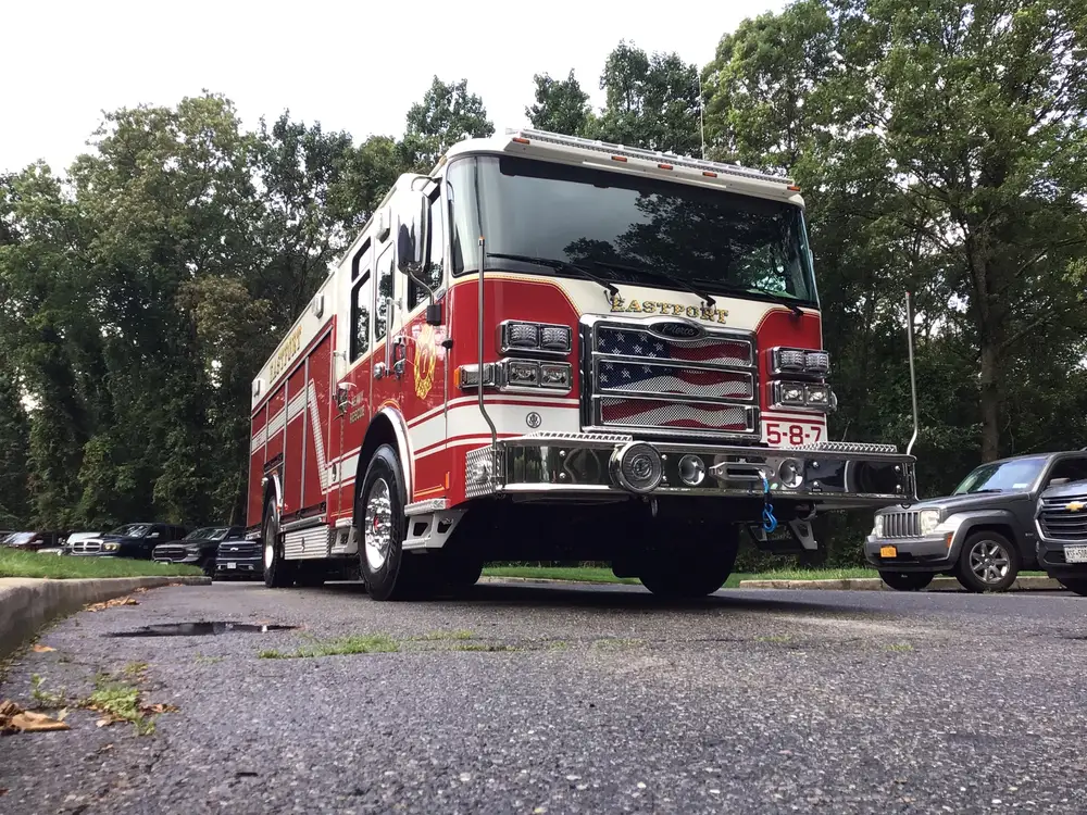 Front-left three-quarter view with cab and pump-panel side