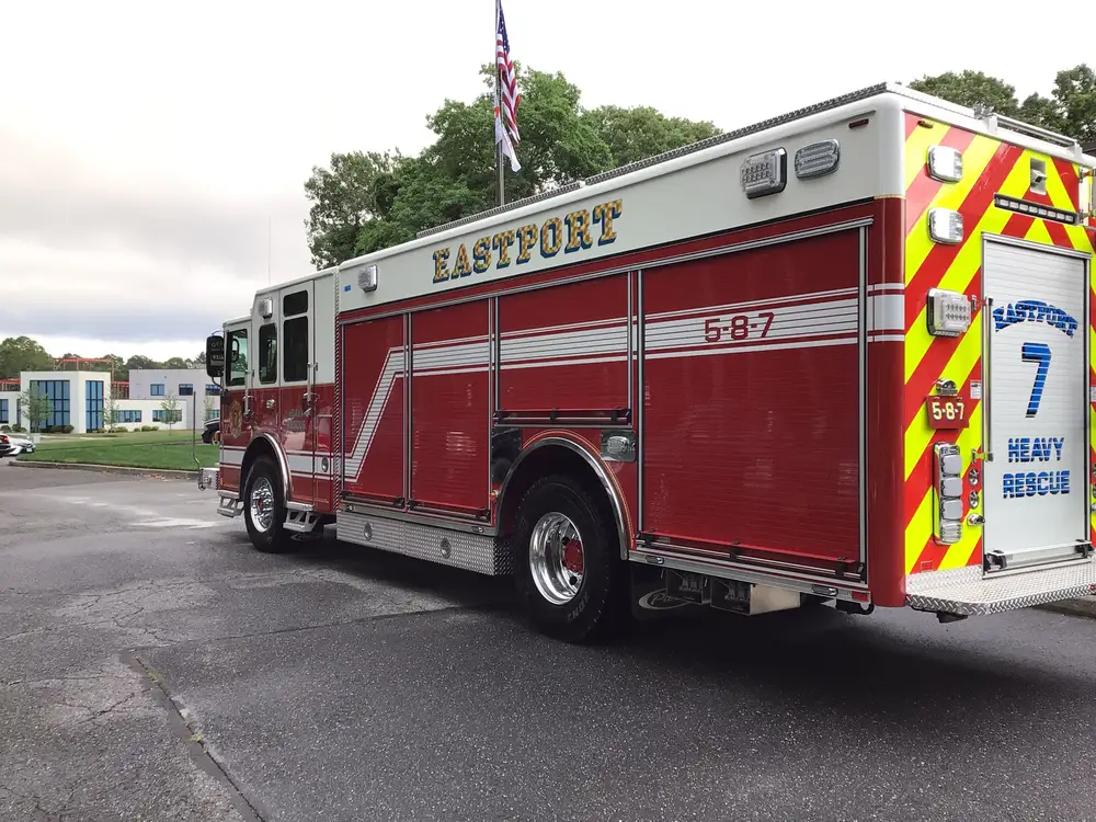 Rear-left exterior view showing chevrons and side compartments