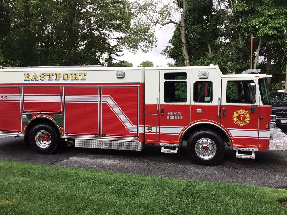 Driver-side profile view showing pump panel and body compartments