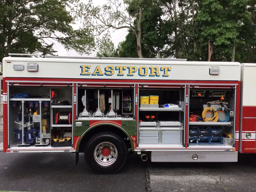 Officer-side profile with multiple open compartments and rear wheel area