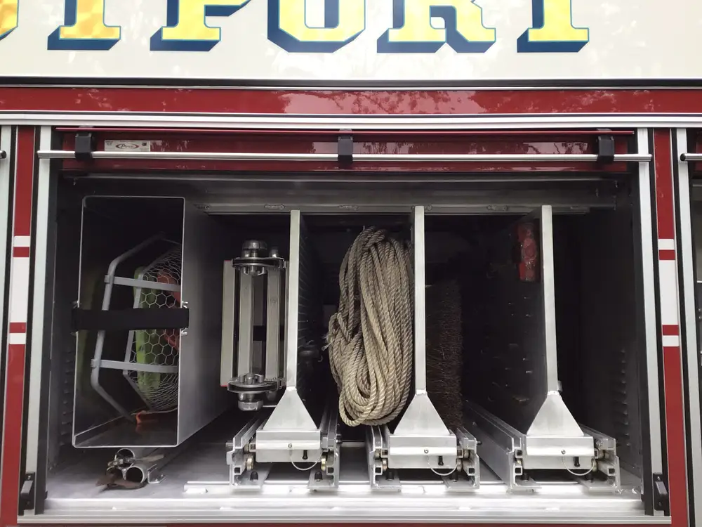 Rear hosebed close-up showing stacked hose and chevron panel
