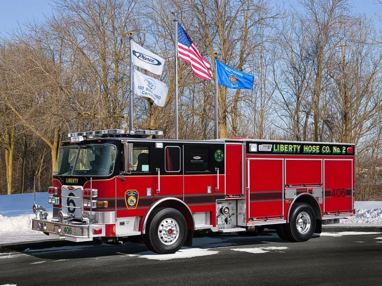 Driver-side profile view showing long body compartments and wheel area