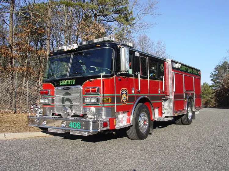 Front-left three-quarter view showing bumper, grille, and cab