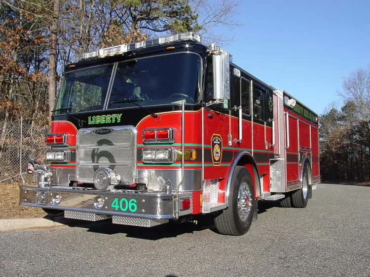 Front-left exterior view showing bumper, cab, and side body