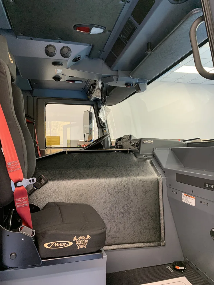 Cab interior rear view showing seat backs and center aisle