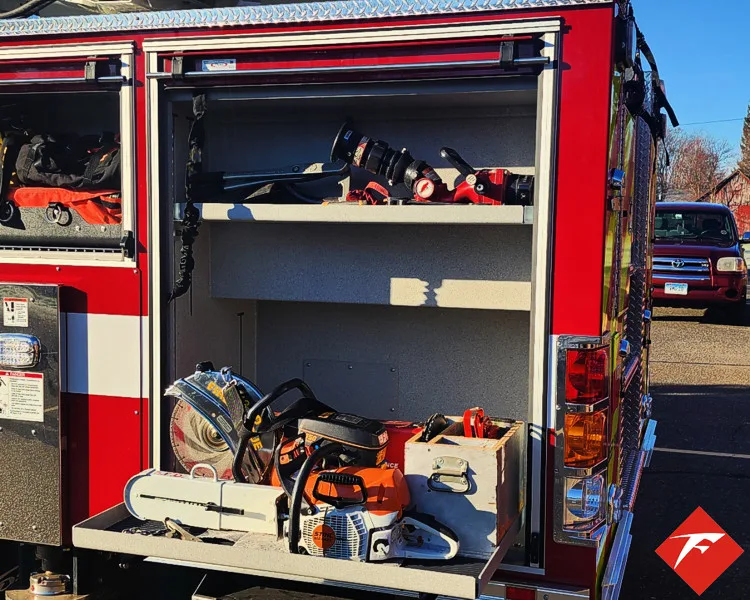 Open side compartment showing shelves with gear and equipment bags