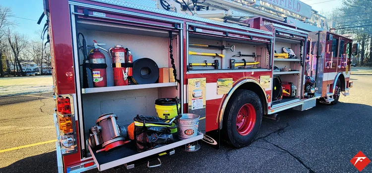 Driver-side profile with open compartments showing full equipment layout