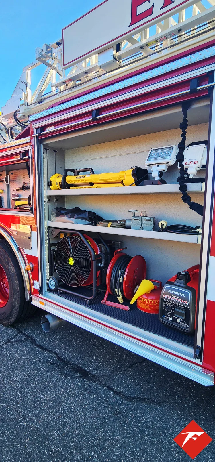 Open side compartment showing shelves with nozzles and small equipment
