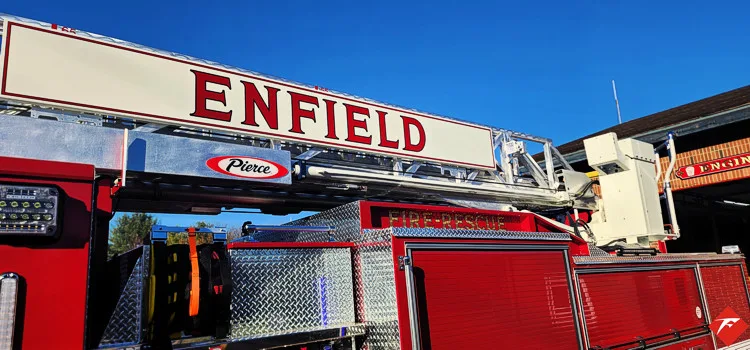 Upper cab and ladder beam close-up showing department lettering