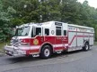 Wide front left shot of the parked heavy rescue unit showing cab and full body length.
