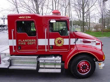Passenger-side cab close-up showing crew doors and front wheel area