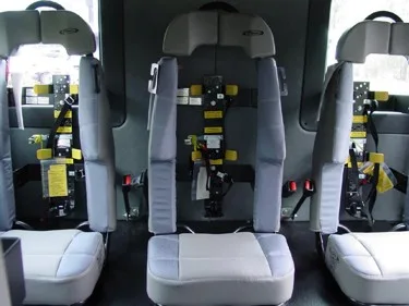 Rear crew seating view showing three SCBA seats with harness mounts