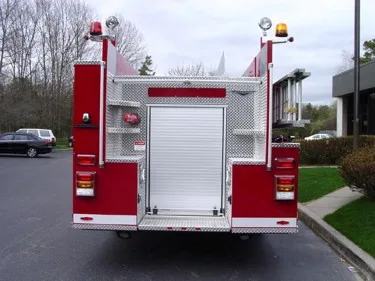 Rear view showing centered roll-up rear door and tail lights