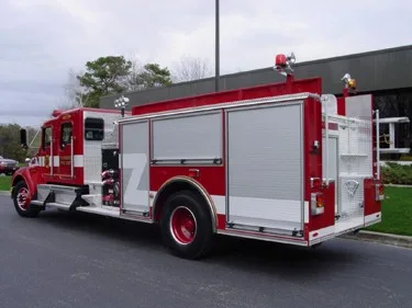 Rear-right exterior view showing closed side compartments and rear body section