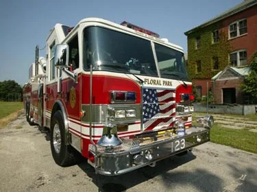 Front-left close view showing grille, bumper, and cab corner