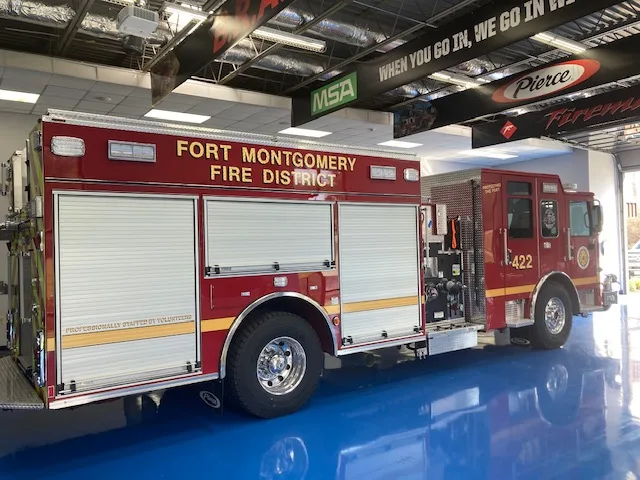 Driver-side profile indoors showing long side body and wheel area