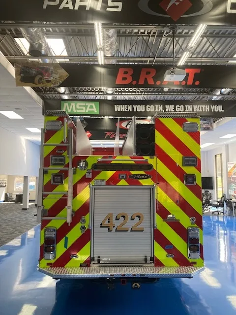 Rear view indoors showing chevron striping and rear roll-up panel