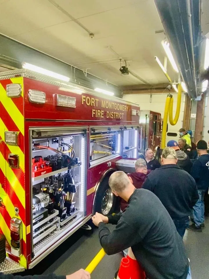 Station service-bay view showing pumper rear and side compartments