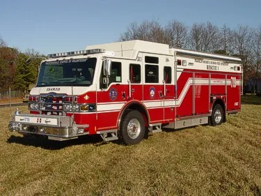 Front-left exterior profile showing crew cab, side compartments, and rescue body