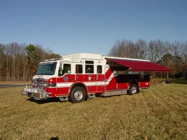 Passenger-side view showing extended side awning over rescue body